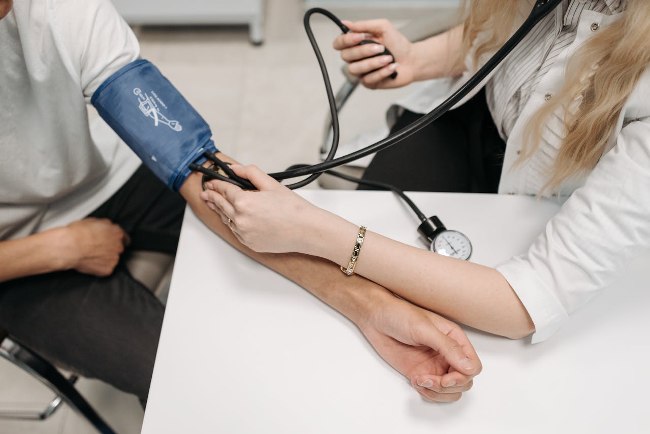 Mastering the First Impression: Your intriguing post title goes here A doctor measures a patient's blood pressure with a sphygmomanometer during a consultation.